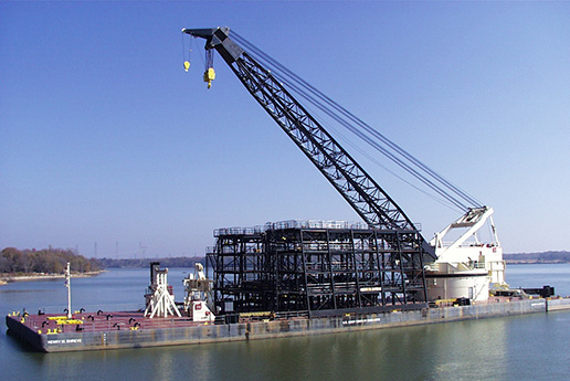 Henry M. Shreve Barge crane traveling down the Mississippi
